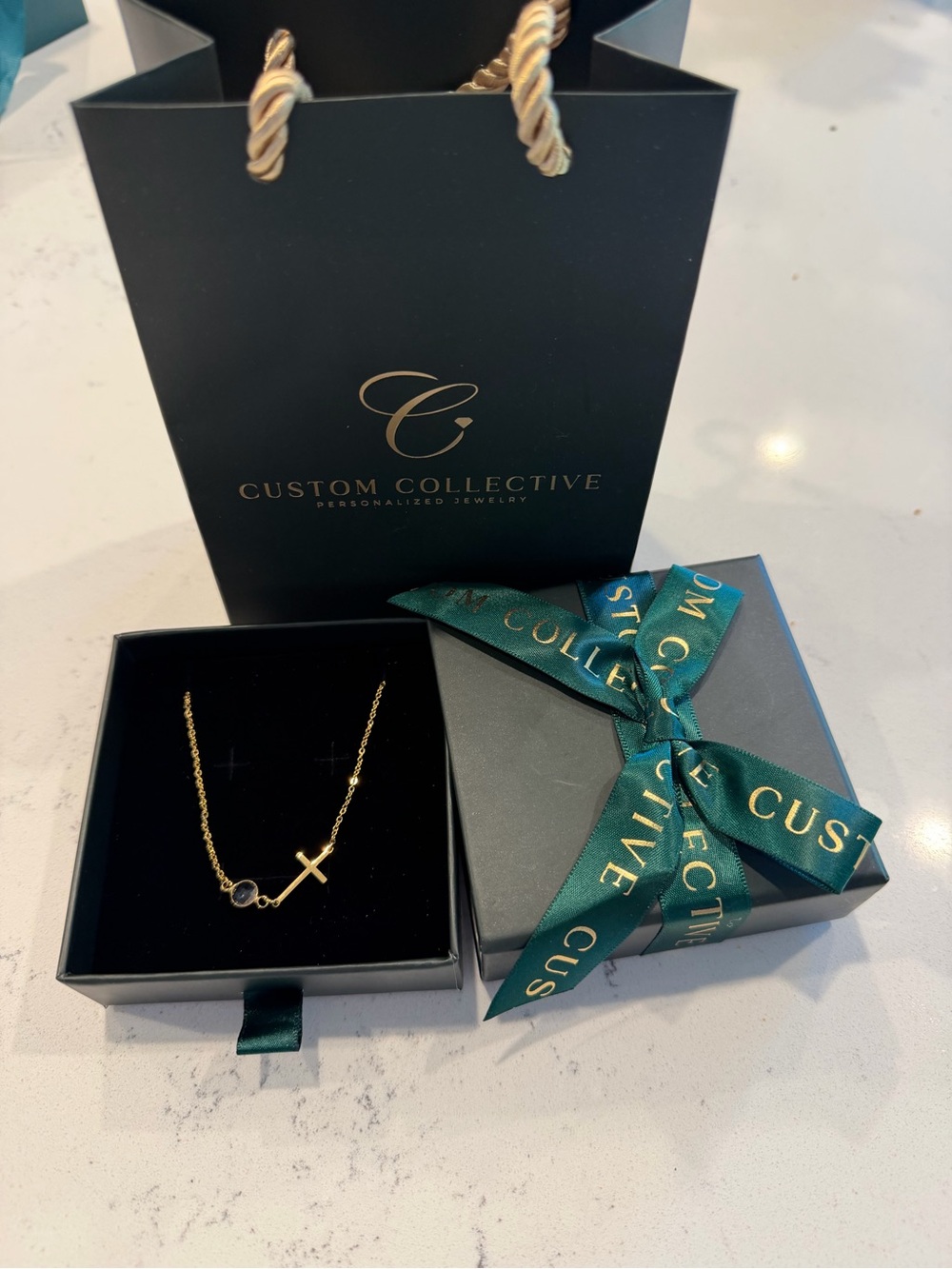 Custom Collective gold cross necklace with birthstone